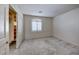Neutral bedroom features a double door closet with custom storage and natural light at 10924 Bandol Pl, Las Vegas, NV 89141