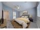 Serene bedroom featuring a ceiling fan, and ample natural light from the window at 10924 Bandol Pl, Las Vegas, NV 89141