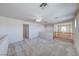 Large bonus room with wood railing, neutral finishes, and good natural light at 10924 Bandol Pl, Las Vegas, NV 89141