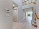 Bright, two-story foyer featuring tile flooring, staircase, and an open view to the living space at 10924 Bandol Pl, Las Vegas, NV 89141