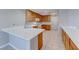 Bright kitchen with oak cabinets, white countertops, and modern appliances at 10924 Bandol Pl, Las Vegas, NV 89141