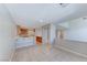 Open-concept living area with tile flooring, open access to the kitchen, and neutral paint colors at 10924 Bandol Pl, Las Vegas, NV 89141