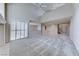 Bright and airy living room featuring vaulted ceilings and access to a kitchen area at 10924 Bandol Pl, Las Vegas, NV 89141