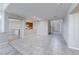 Open-concept living space featuring tile floors, fireplace, and a kitchen with a breakfast bar at 10924 Bandol Pl, Las Vegas, NV 89141