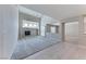 Spacious living room featuring high ceilings, fireplace, carpet, and an open design at 10924 Bandol Pl, Las Vegas, NV 89141