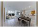 Open-concept living space with fireplace, dining area, and a view of the kitchen at 10924 Bandol Pl, Las Vegas, NV 89141