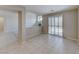 Spacious living area featuring tile floors and sliding glass doors to outdoor space at 10924 Bandol Pl, Las Vegas, NV 89141