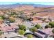 A residential neighborhood with mountain views and neatly maintained homes creates a peaceful community atmosphere at 10924 Bandol Pl, Las Vegas, NV 89141