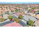 An aerial view shows an expansive neighborhood with desert landscaping creating a warm and inviting community at 10924 Bandol Pl, Las Vegas, NV 89141