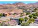 View of a residential neighborhood with desert landscaping creating a warm and inviting community at 10924 Bandol Pl, Las Vegas, NV 89141