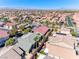 An expansive neighborhood features well-maintained homes, lush landscaping, and orderly streets creating a welcoming community at 10924 Bandol Pl, Las Vegas, NV 89141