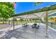 Shaded picnic tables available for residents in a common play area on a bright sunny day at 10924 Bandol Pl, Las Vegas, NV 89141