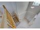 Bright view of the staircase with tile landing, carpet steps and chandelier lighting at 10924 Bandol Pl, Las Vegas, NV 89141