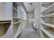 Spacious walk-in closet offering ample shelving, hanging rods and storage space at 10924 Bandol Pl, Las Vegas, NV 89141