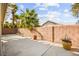 Relax and enjoy the private backyard oasis surrounded by brick wall and lush greenery at 1184 Warm Canyon Way, Las Vegas, NV 89123