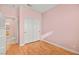 Bright bedroom features wood floors, neutral walls, and a closet with sliding doors at 1184 Warm Canyon Way, Las Vegas, NV 89123