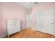 Bright bedroom features wood floors, neutral walls, and an open ensuite bathroom at 1184 Warm Canyon Way, Las Vegas, NV 89123