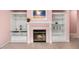 Close up of a living room featuring a cozy fireplace, built-in shelving, and tile flooring at 1184 Warm Canyon Way, Las Vegas, NV 89123