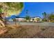 Night shot featuring desert landscaping, bench seating, a circular driveway and attached garage at 1401 S 17Th St, Las Vegas, NV 89104