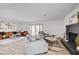 Bright open living room with updated floors, fresh paint, and a decorative brick fireplace at 1401 S 17Th St, Las Vegas, NV 89104