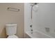 A well-maintained bathroom featuring a toilet and a white tiled bathtub/shower combo at 1405 Vegas Valley Dr # 170, Las Vegas, NV 89169