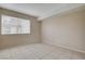 Bright bedroom featuring tile floors, neutral paint, and a window allowing natural light at 1405 Vegas Valley Dr # 170, Las Vegas, NV 89169