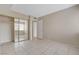 Large bedroom with tile floors, closet with mirrored doors, and doorway to hallway at 1405 Vegas Valley Dr # 170, Las Vegas, NV 89169