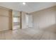 Bedroom features tile floors, closet with mirrored doors, and doorway to hallway at 1405 Vegas Valley Dr # 170, Las Vegas, NV 89169