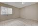 Bedroom featuring tile floors, neutral paint, and a window allowing natural light at 1405 Vegas Valley Dr # 170, Las Vegas, NV 89169