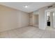 Bedroom features tile floors, closet with mirrored doors, and doorway to bathroom at 1405 Vegas Valley Dr # 170, Las Vegas, NV 89169