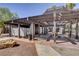 Community outdoor shaded lounge area with wooden pergola and lounge furniture at 1405 Vegas Valley Dr # 170, Las Vegas, NV 89169