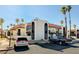 Exterior view shows the condo complex with parking area and palm tree landscaping at 1405 Vegas Valley Dr # 170, Las Vegas, NV 89169
