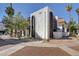 Inviting condo exterior with stucco facade, mature trees, and manicured landscaping at 1405 Vegas Valley Dr # 170, Las Vegas, NV 89169