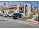 Exterior view of a condo featuring stucco walls, red tile roof, balconies, and dedicated parking spaces in a community setting at 1405 Vegas Valley Dr # 170, Las Vegas, NV 89169
