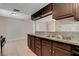 Shows granite countertops, stainless steel sink and dark cabinets at 1405 Vegas Valley Dr # 170, Las Vegas, NV 89169