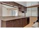 Features granite countertops, dark wood cabinets, stainless steel sink and appliances at 1405 Vegas Valley Dr # 170, Las Vegas, NV 89169