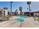 Community pool and hot tub surrounded by palm trees, offering a relaxing and tropical atmosphere for residents at 1405 Vegas Valley Dr # 170, Las Vegas, NV 89169