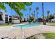 Exterior shot shows a refreshing community pool surrounded by palm trees and well-maintained residential buildings at 1405 Vegas Valley Dr # 170, Las Vegas, NV 89169