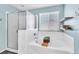 Bright bathroom with a soaking tub and a separate glass-enclosed shower at 1422 Ozzie Smith Ave, Henderson, NV 89074