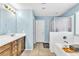 Well-lit bathroom featuring a double vanity, tub, and separate shower at 1422 Ozzie Smith Ave, Henderson, NV 89074