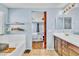 Bathroom featuring double vanity, tub, shower, and view of the bedroom at 1422 Ozzie Smith Ave, Henderson, NV 89074