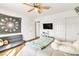 A cozy bedroom features laminate floors, ceiling fan and ample closet space at 1422 Ozzie Smith Ave, Henderson, NV 89074