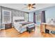 Charming bedroom with stylish wood accent wall, and a modern ceiling fan at 1422 Ozzie Smith Ave, Henderson, NV 89074