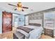 Inviting bedroom showcasing a sliding barn door and modern decor at 1422 Ozzie Smith Ave, Henderson, NV 89074