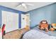 Charming bedroom with blue walls, fan and spacious closet; perfect for relaxation at 1422 Ozzie Smith Ave, Henderson, NV 89074