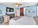 Spacious bedroom featuring a mounted television and wooden barn door at 1422 Ozzie Smith Ave, Henderson, NV 89074