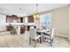 Bright dining area with a stylish chandelier and seating for four at 1422 Ozzie Smith Ave, Henderson, NV 89074
