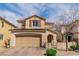 Charming two-story home features a well-kept front yard and a two-car garage at 1422 Ozzie Smith Ave, Henderson, NV 89074