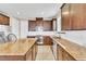 Bright kitchen features granite countertops, stainless appliances, and rich wood cabinetry at 1422 Ozzie Smith Ave, Henderson, NV 89074