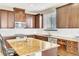 Kitchen features granite countertops, stainless appliances, island, and ample storage at 1422 Ozzie Smith Ave, Henderson, NV 89074